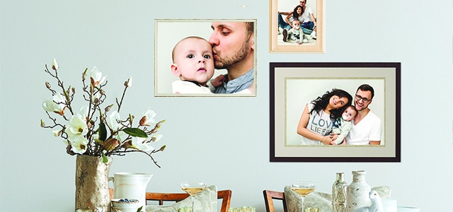 Framed images on white wall