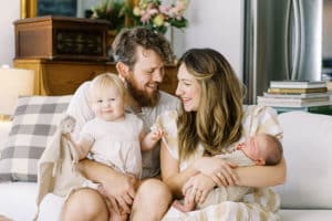 happy family sitting on couch