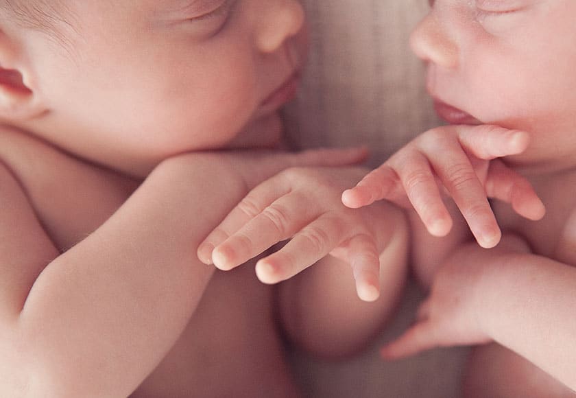 closeup of twin babies' hands