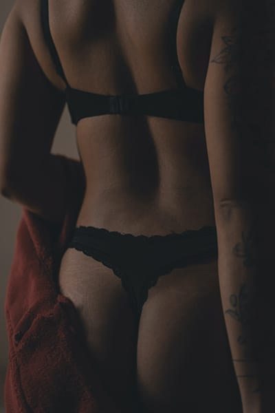 low key boudoir photo of the back of a woman  