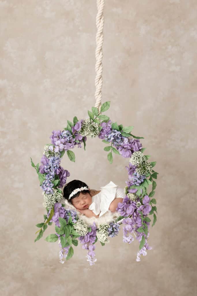 Image by Stephanie Schnautz: a baby posed in flower wreath