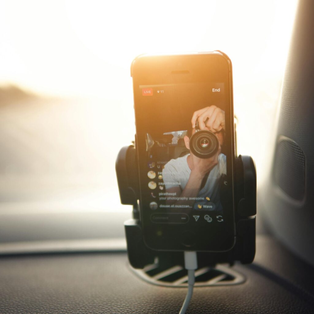 Instagram live video of man Holding Camera lens toward phone