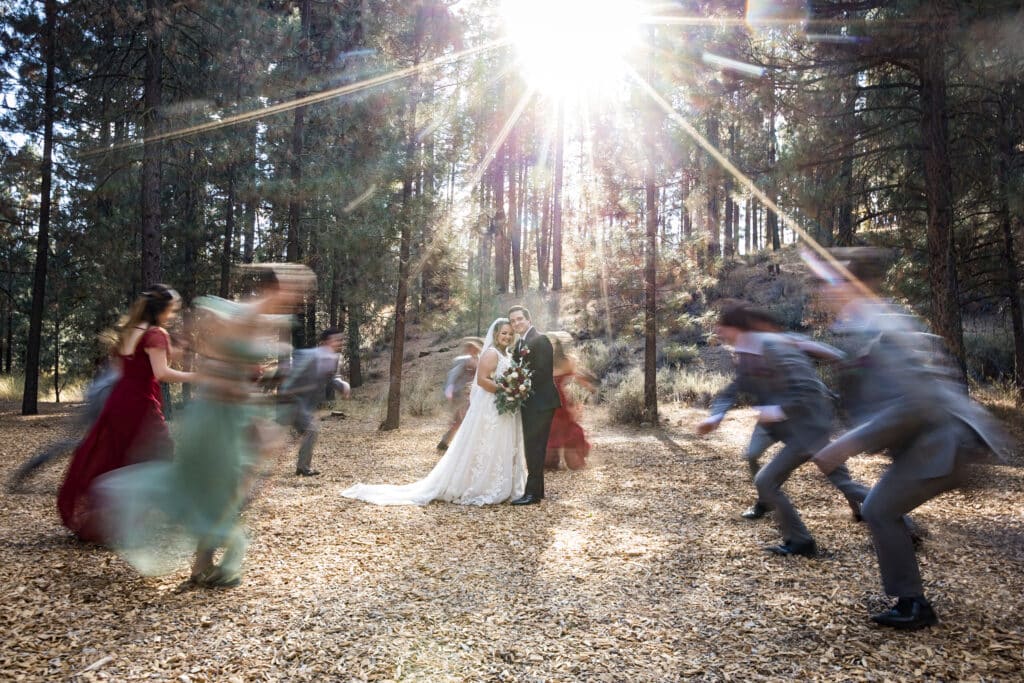 Wedding party running around bride and groom Jeramie Lu
