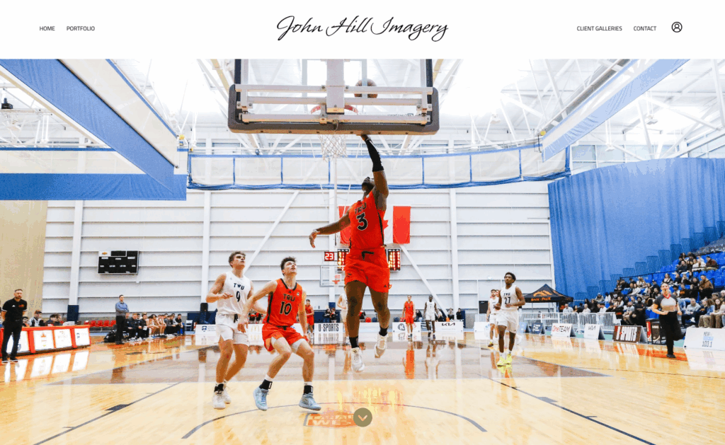 Basketball player in orange jersey shooting during a game; photography by John Hill