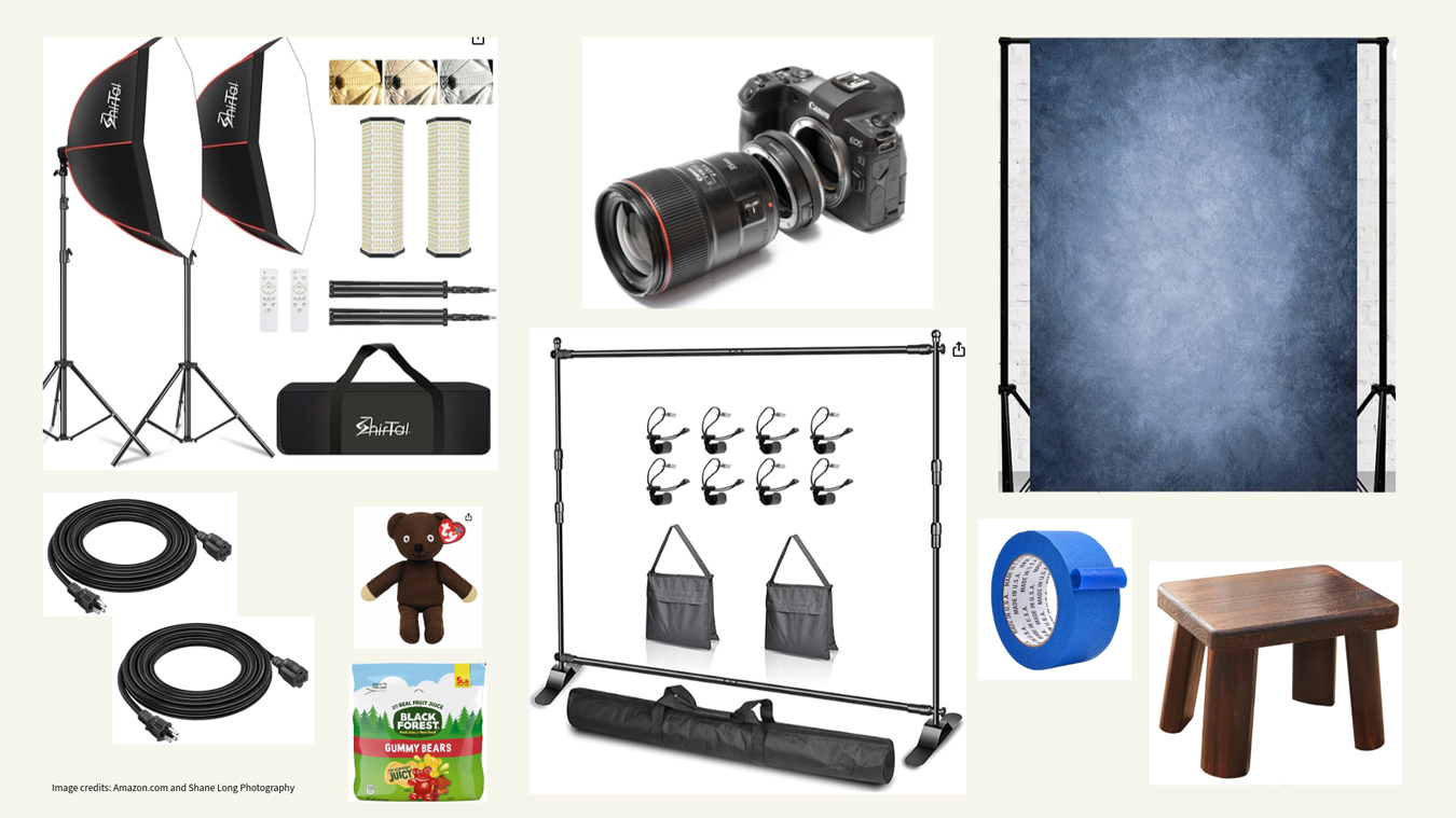 Photo studio setup: lighting, camera, backdrop stand, blue backdrop, cables, and small stool