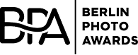 The image shows the logo for the Berlin Photo Awards, with the letters BPA stylized on the left and the words BERLIN PHOTO AWARDS to the right. The logo is in white against a black background.