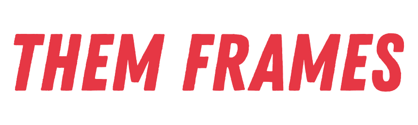 The image displays the text "THEM FRAMES" in a bold, slightly distressed red font against a black background. The text is angled slightly upwards from left to right.